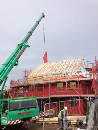Roof of timber frame home being erected.