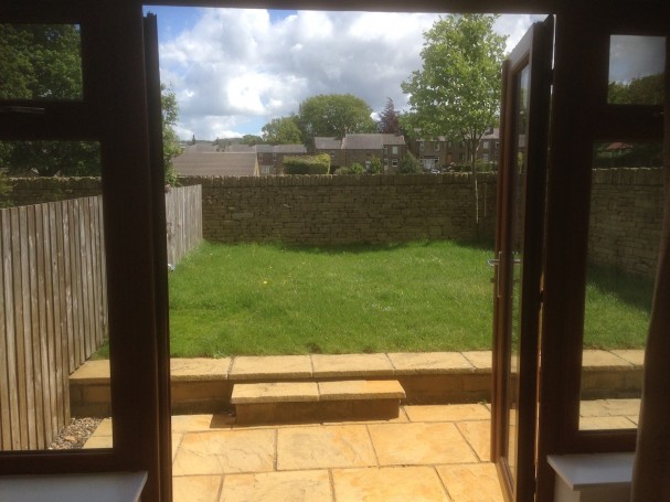 French doors from living room leading into garden.