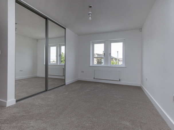 Spacious bedroom with fitted wardrobe