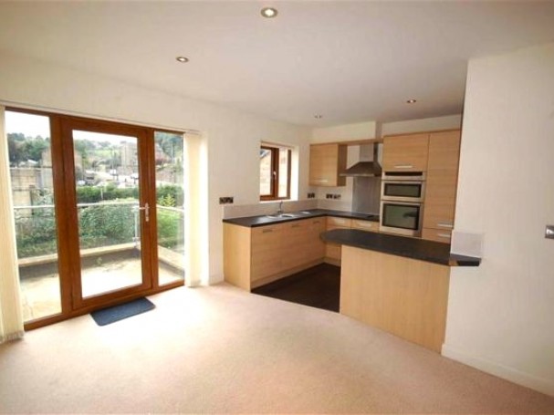 The spacious open plan living area opens out onto a large balcony. The spacious open plan living area opens out onto a large balcony.